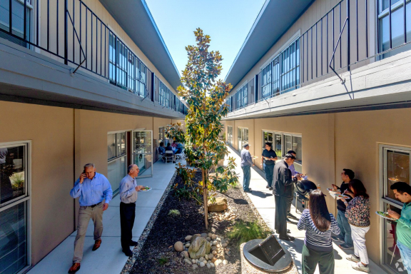 People moving around in the courtyard at San Tomas