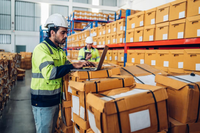 Workers in warehouse loading boxes